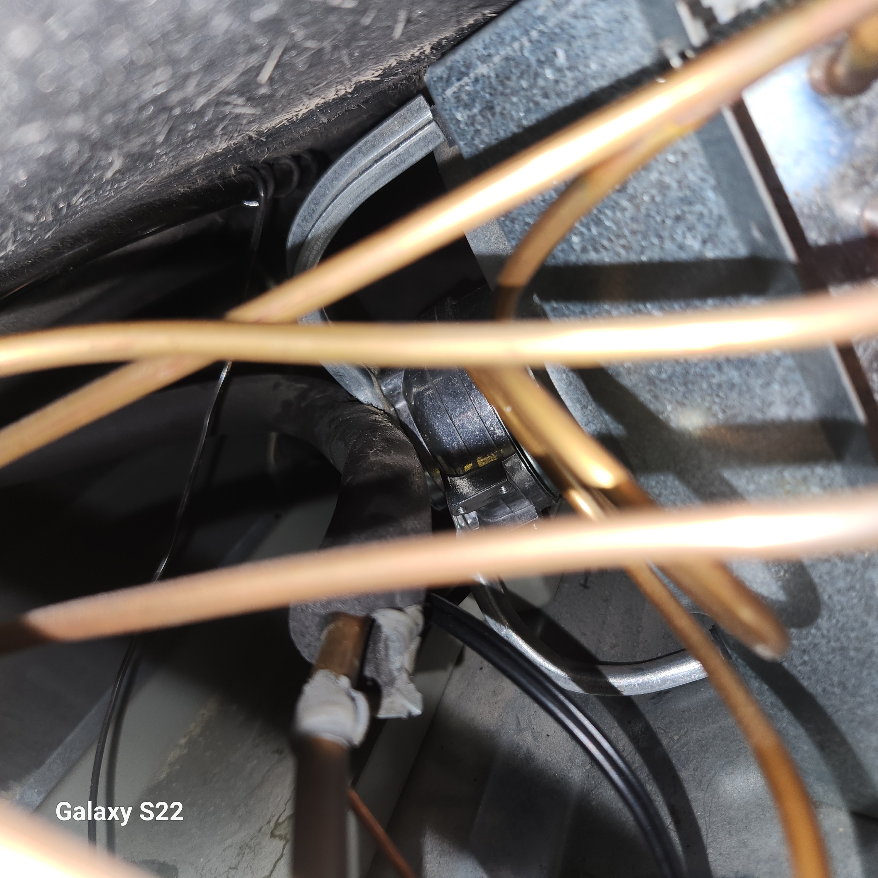 Worn insulation on the suction line of a Sub-Zero 736 where it rubbed against a steel fan bracket, found during a Dunwoody service call